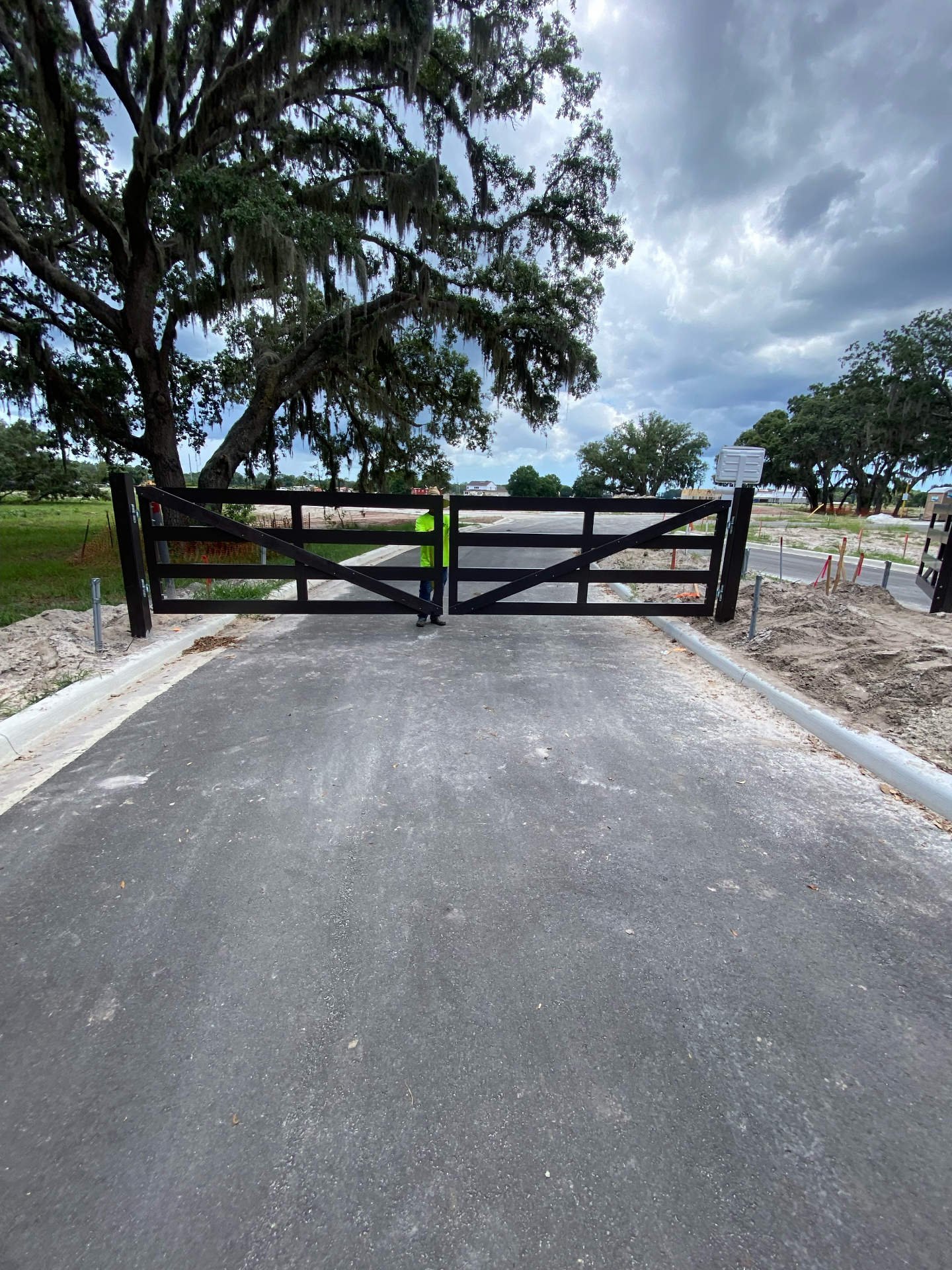 Black ranch-style double swing entry gate